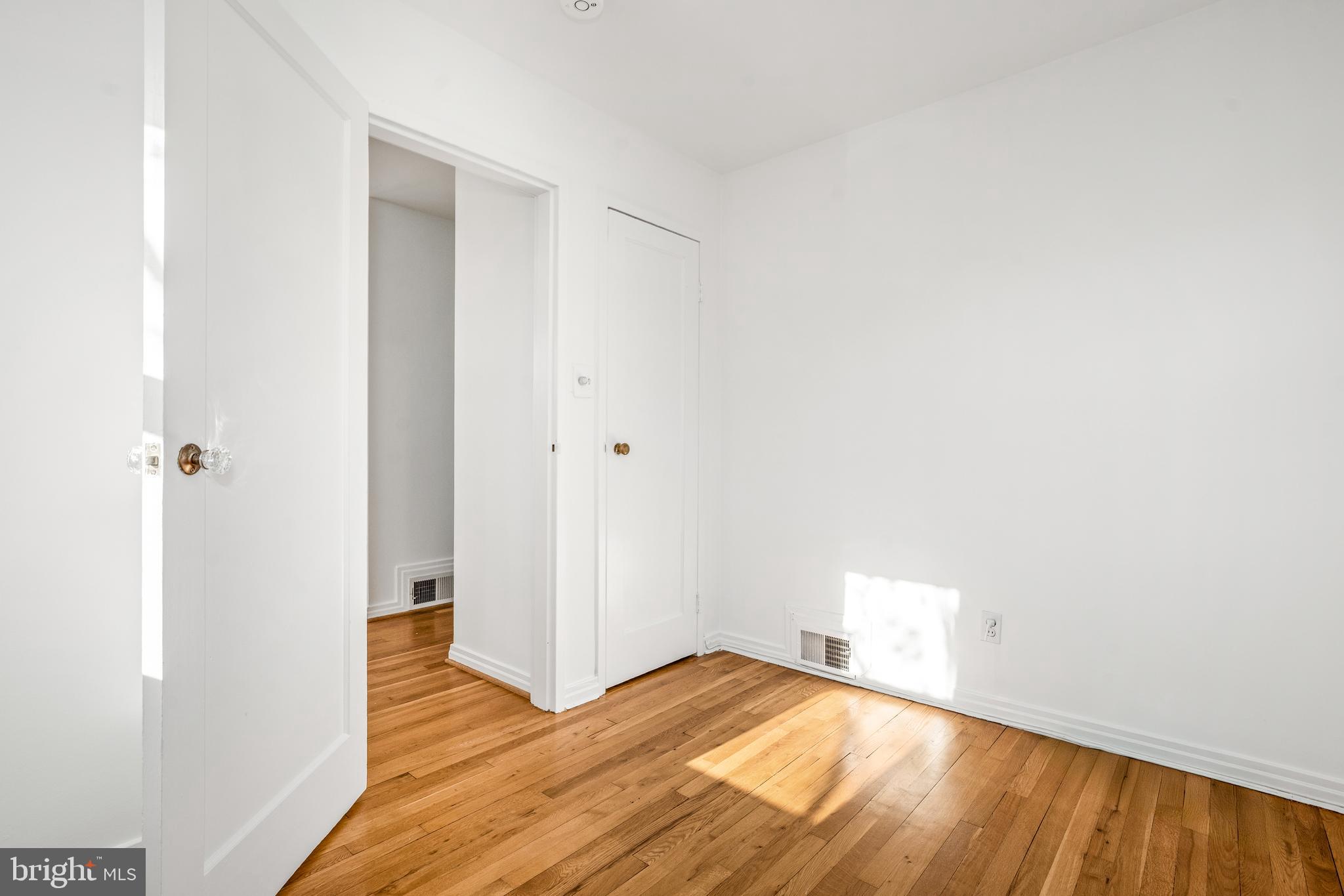 2700 Spencer Road Chevy Chase, MD 20815 - Photo 30 of 40 a view of empty room with wooden floor