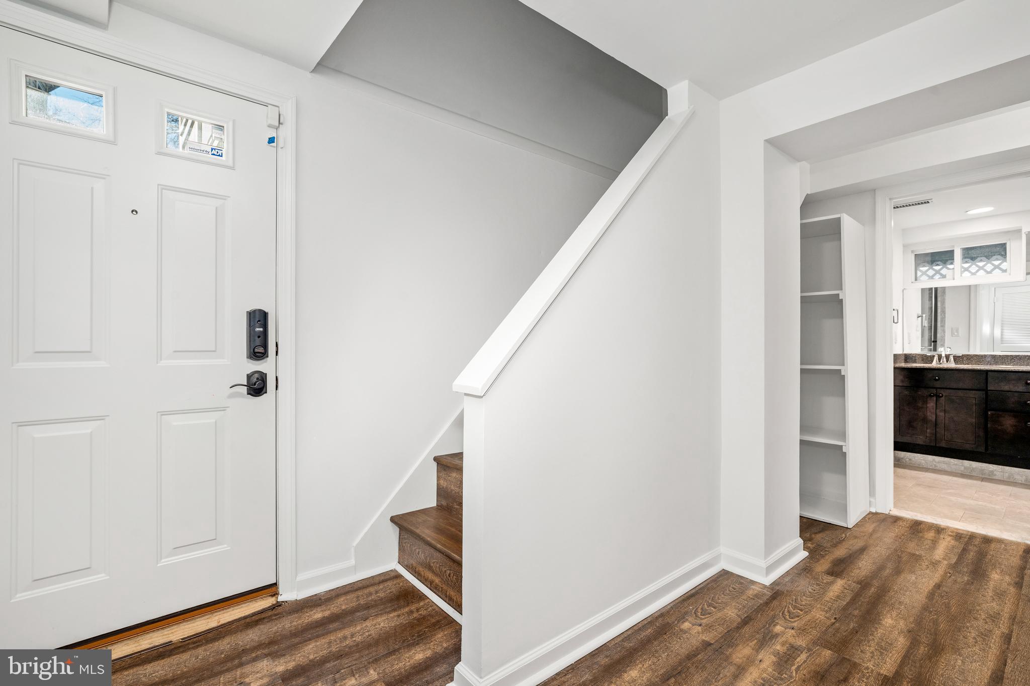 2700 Spencer Road Chevy Chase, MD 20815 - Photo 35 of 40 a view of a hallway with wooden floor and staircase