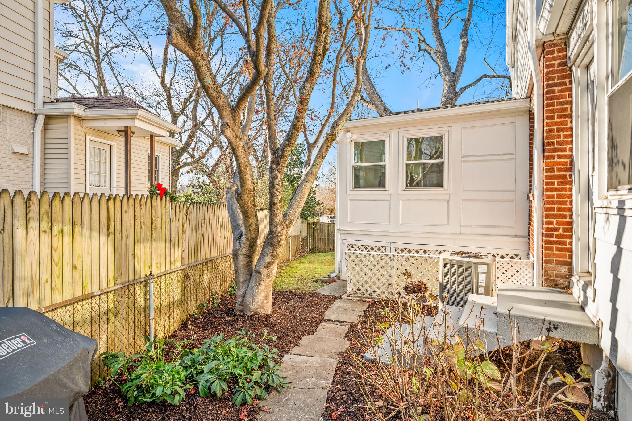 2700 Spencer Road Chevy Chase, MD 20815 - Photo 37 of 40 a front view of a house with a yard