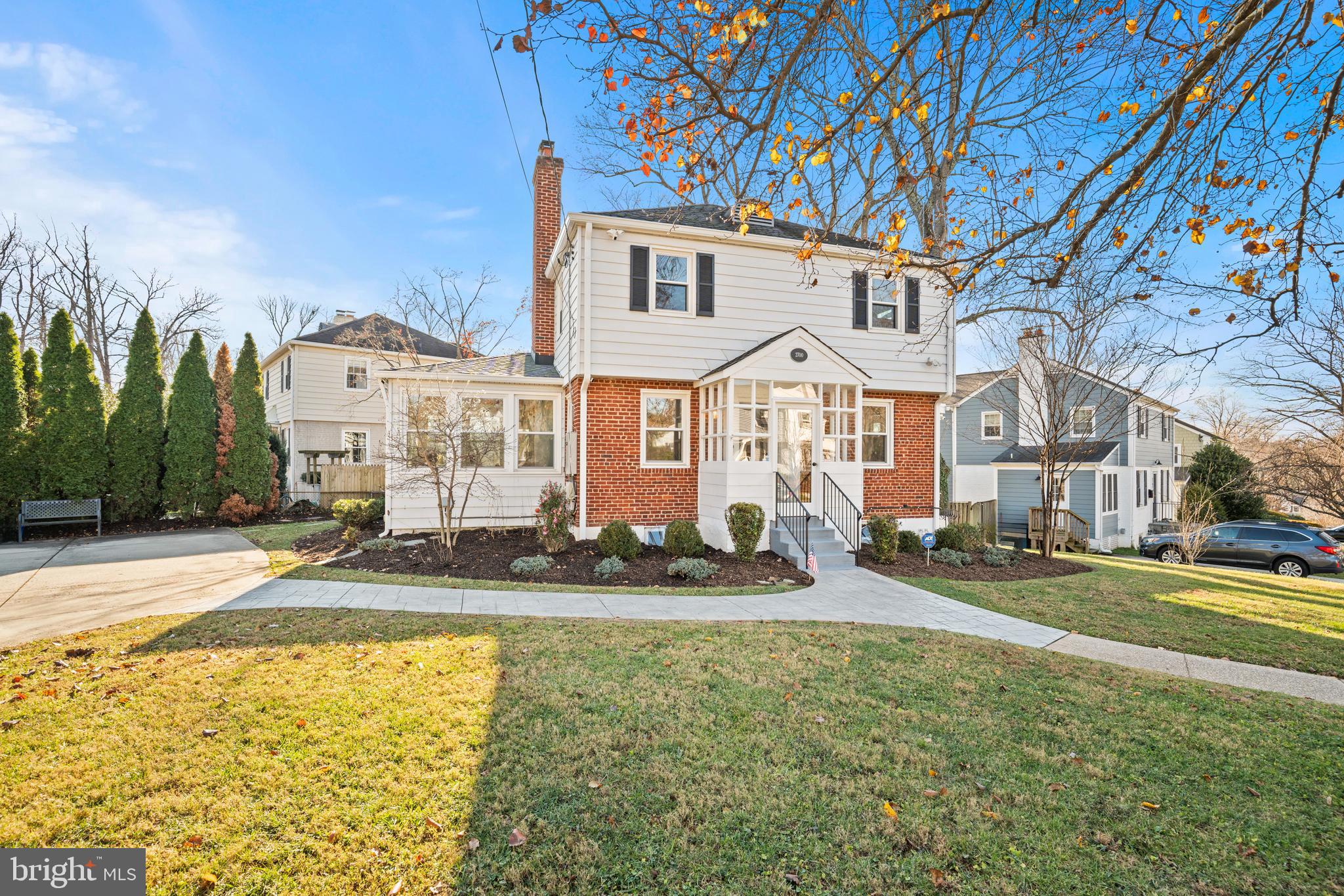 2700 Spencer Road Chevy Chase, MD 20815 - Photo 39 of 40 a front view of a building with a yard