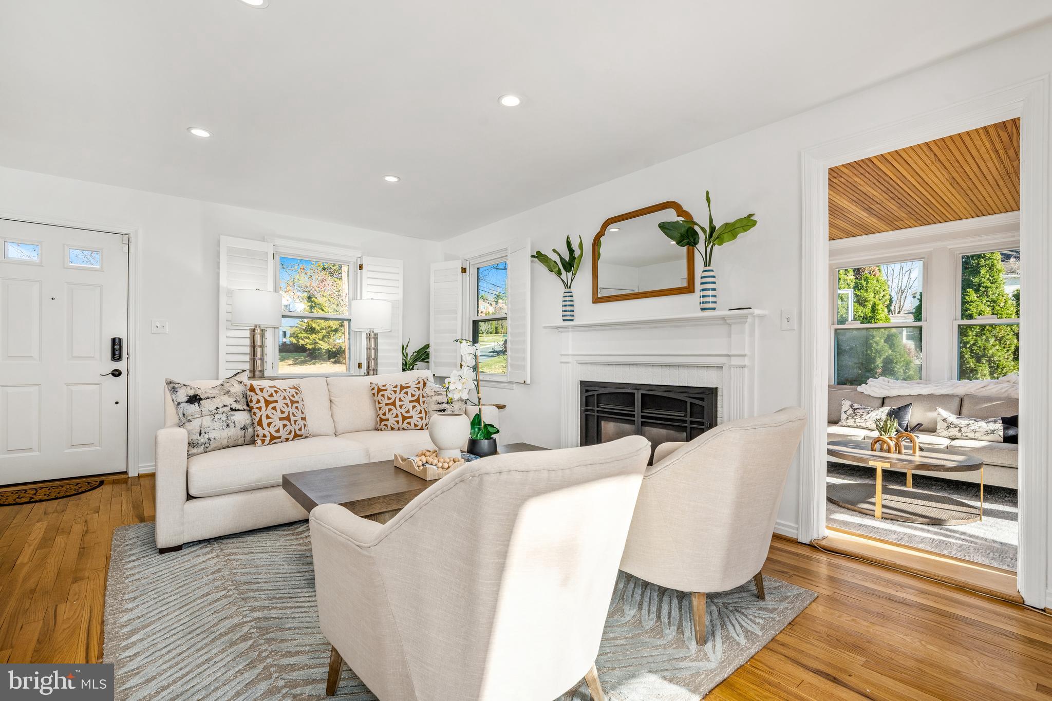 2700 Spencer Road Chevy Chase, MD 20815 - Photo 4 of 40 a living room with fireplace furniture and a large window