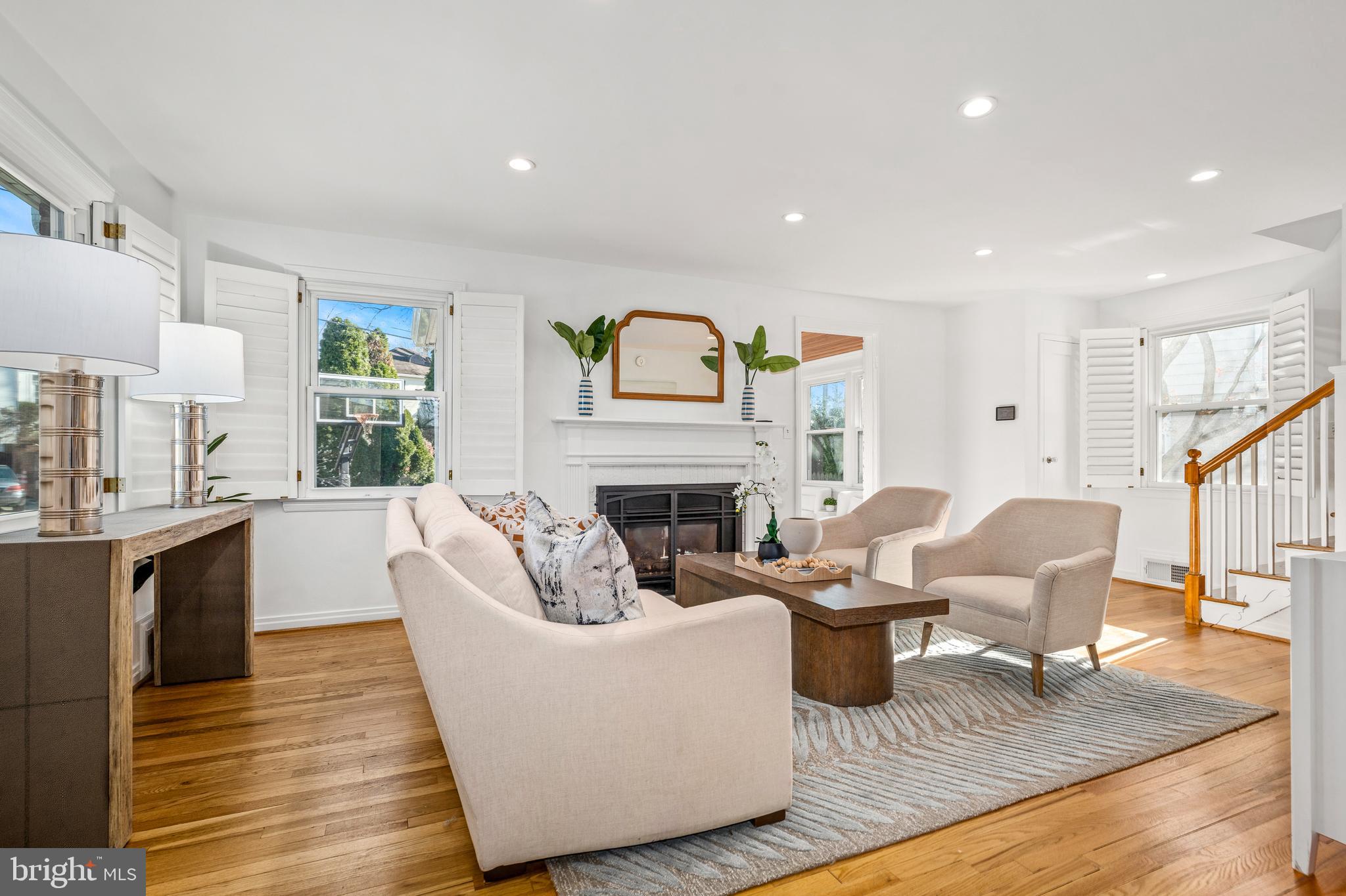 2700 Spencer Road Chevy Chase, MD 20815 - Photo 5 of 40 a living room with fireplace furniture and a wooden floor