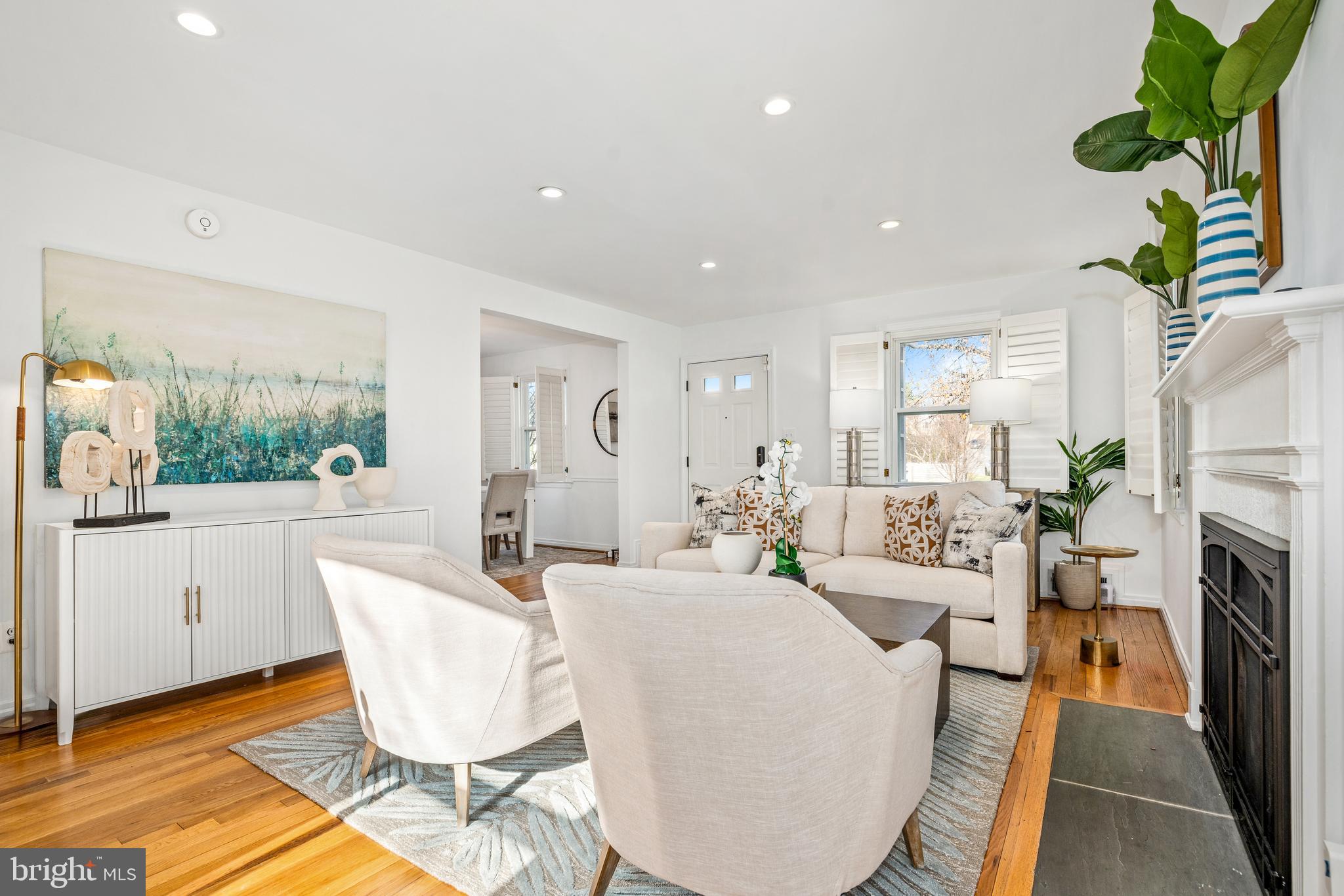 2700 Spencer Road Chevy Chase, MD 20815 - Photo 6 of 40 a living room with fireplace furniture and a large window