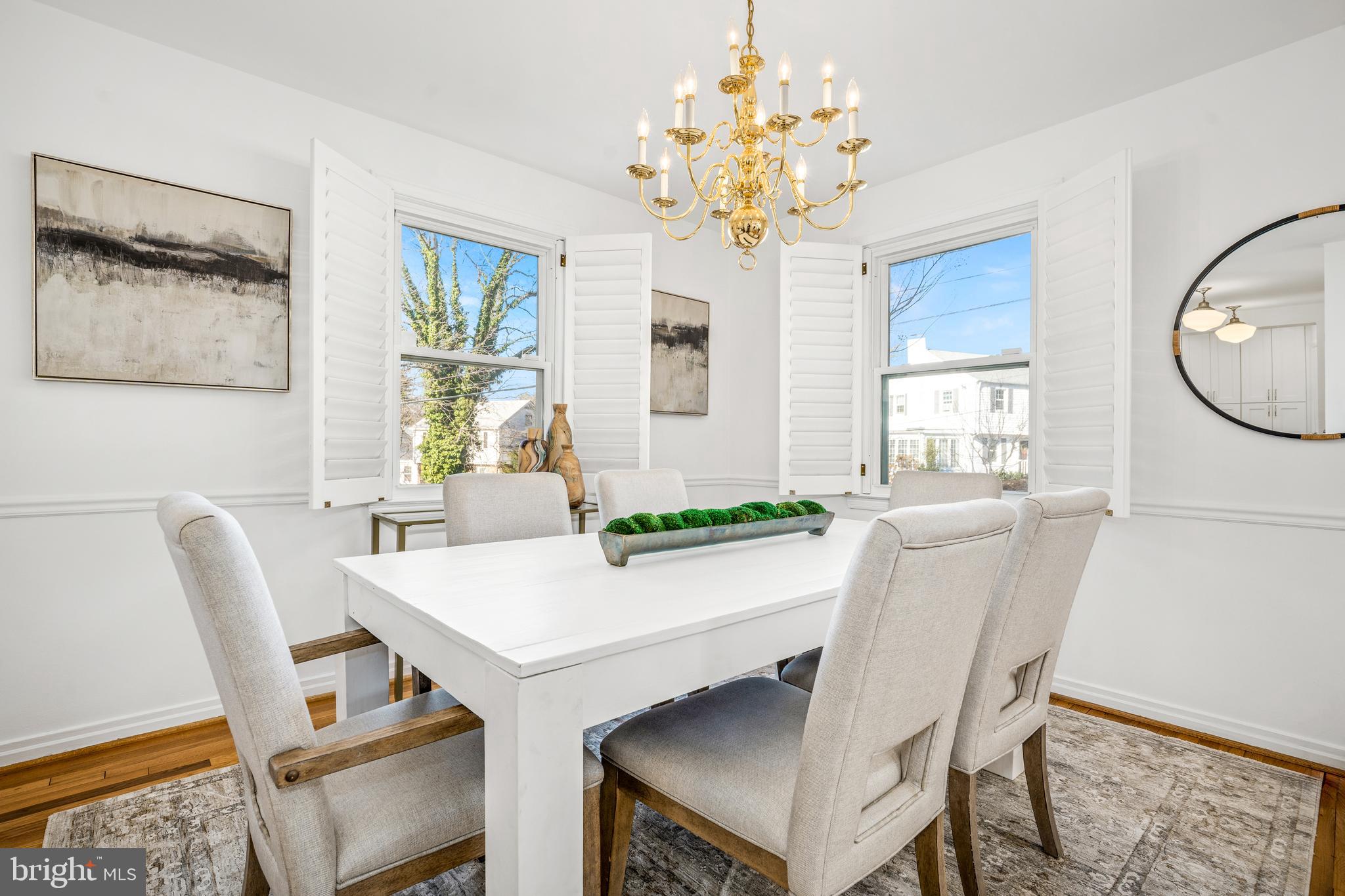 2700 Spencer Road Chevy Chase, MD 20815 - Photo 10 of 40 a view of a dining room with furniture and chandelier