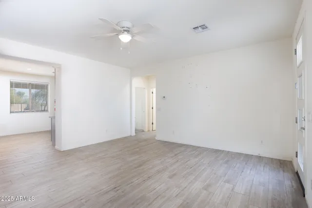 a view of an empty room with a window