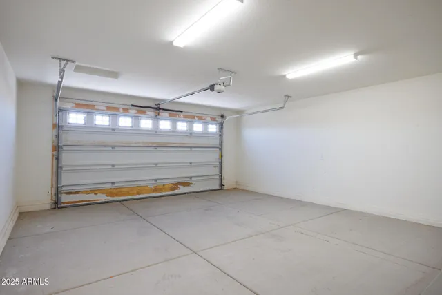 an empty room with a glass door shower