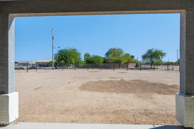 a view of an house with backyard and porch