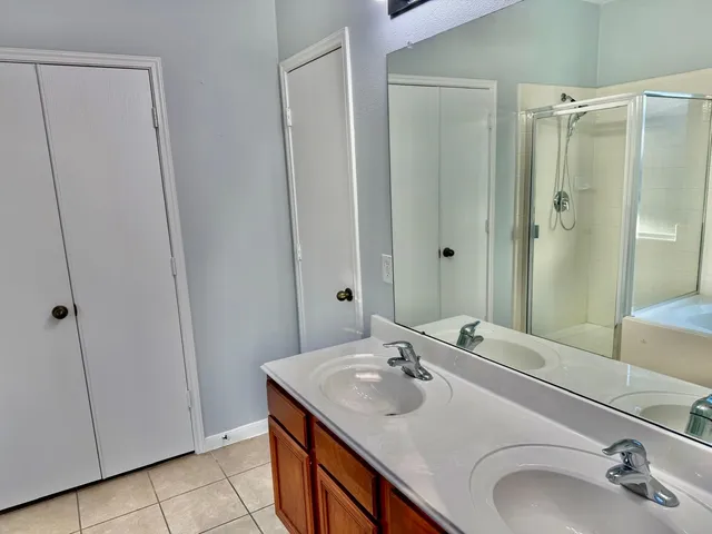 a bathroom with a tub and shower