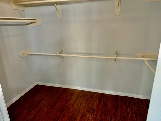 a view of washer and dryer with wooden floor