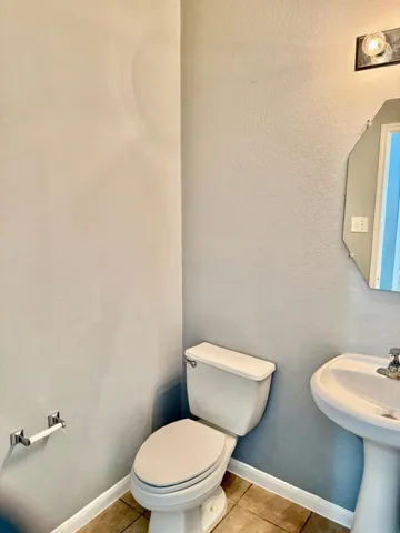 a view of a room with wooden floor and a window