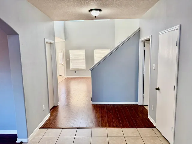 a view of a hallway view with staircase