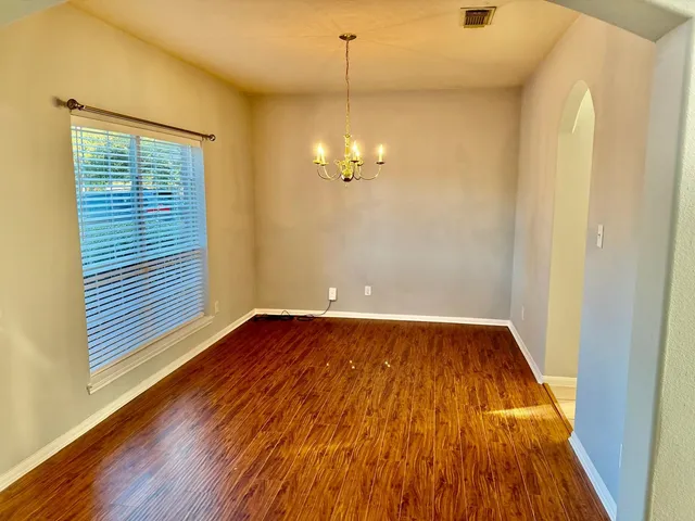 a view of a livingroom with wooden floor