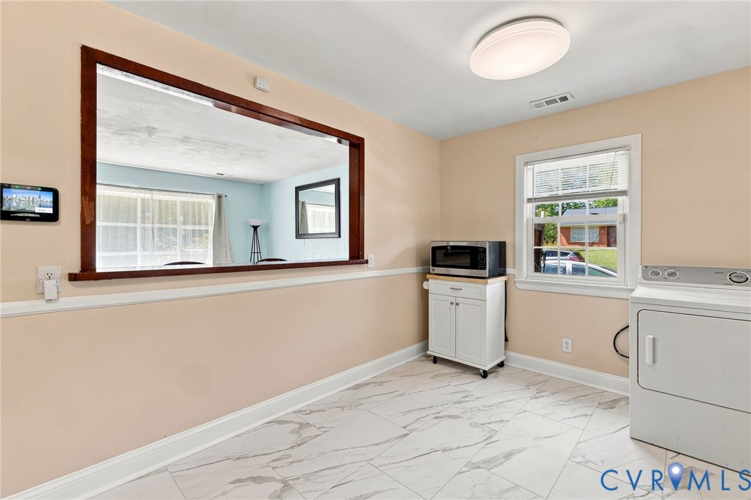 1700 Sizer Road Richmond, VA 23222 - Photo 8 of 16 Pass-through window with wood trim, tile flooring,