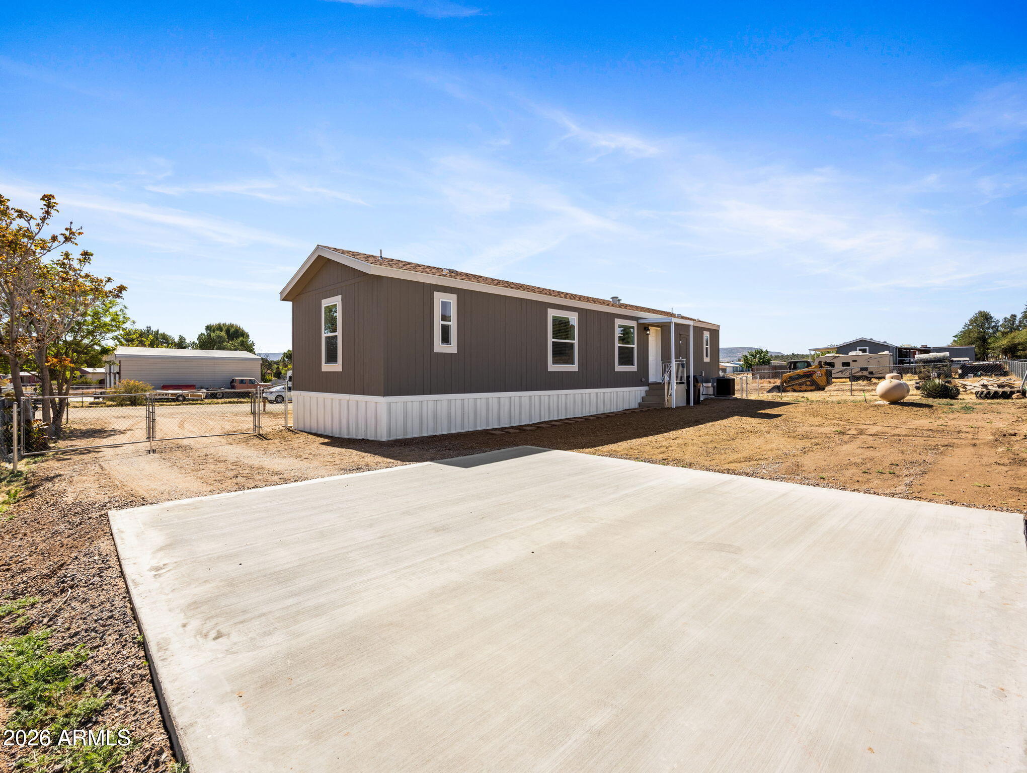 18296 Frontier Road Peeples Valley, AZ 86332 - Photo 29 of 44 a front view of a house with a yard