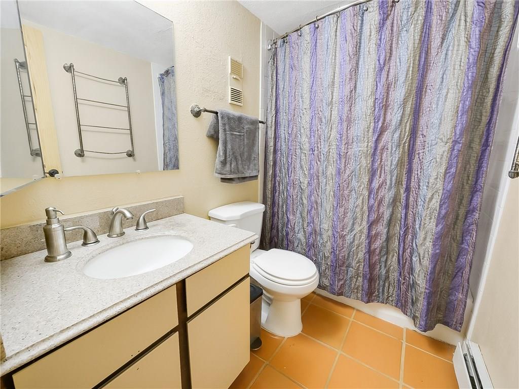8100 Ryan Gulch Road, Unit E206 Silverthorne, CO 80498 - Photo 15 of 32 a bathroom with a granite countertop sink and a mirror