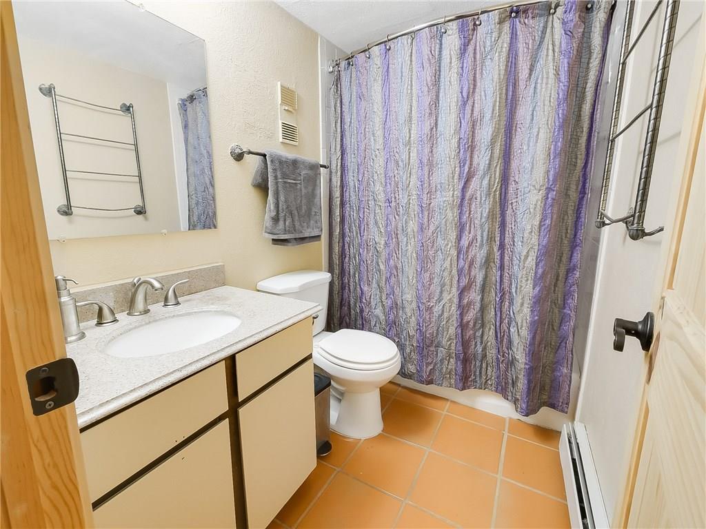 8100 Ryan Gulch Road, Unit E206 Silverthorne, CO 80498 - Photo 24 of 32 a bathroom with a sink and a mirror