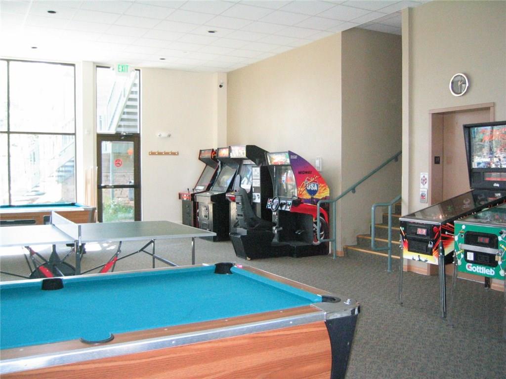 8100 Ryan Gulch Road, Unit E206 Silverthorne, CO 80498 - Photo 25 of 32 a children room with furniture and a window
