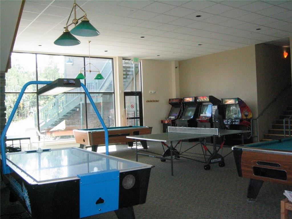 8100 Ryan Gulch Road, Unit E206 Silverthorne, CO 80498 - Photo 26 of 32 a room with furniture and a window