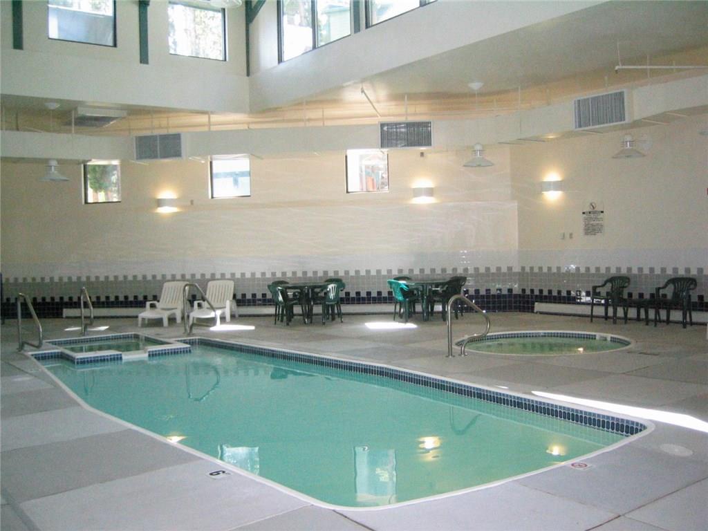 8100 Ryan Gulch Road, Unit E206 Silverthorne, CO 80498 - Photo 28 of 32 a view of a swimming pool and outdoor space