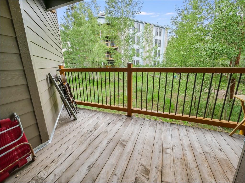 8100 Ryan Gulch Road, Unit E206 Silverthorne, CO 80498 - Photo 6 of 32 a view of a balcony with wooden floor