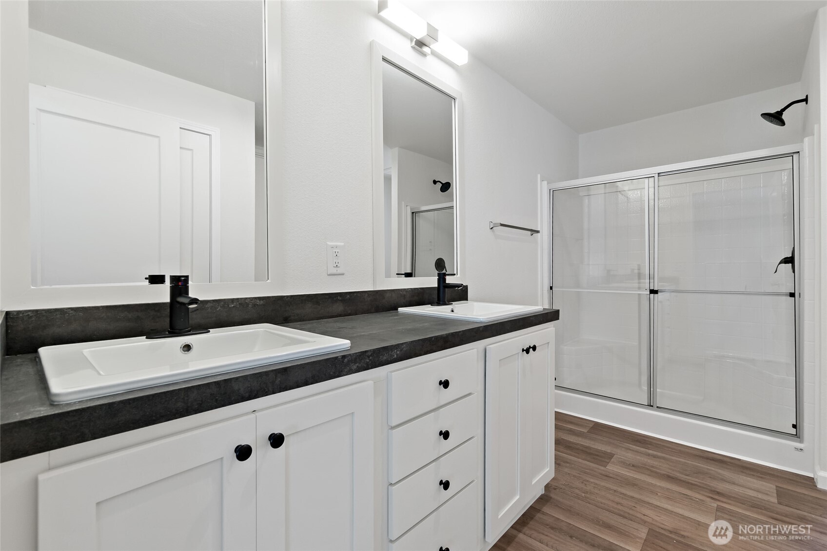 17217 80th Street Southwest Longbranch, WA 98351 - Photo 20 of 39 a bathroom with a double vanity sink and mirror
