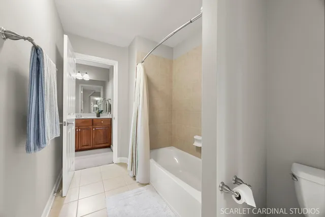 a bathroom with a tub a toilet and a sink