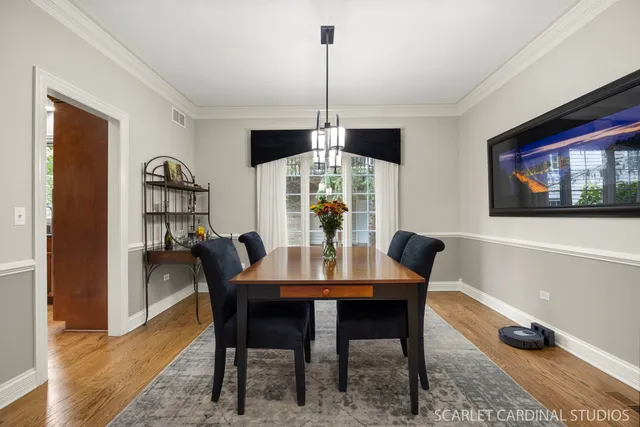 a dining room with furniture and window