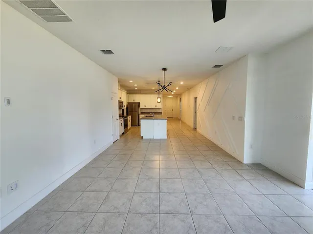 a view of a livingroom with a kitchen