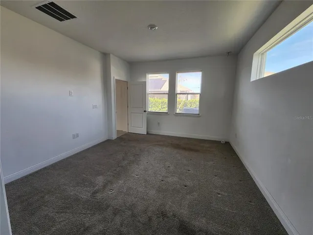 an empty room with windows