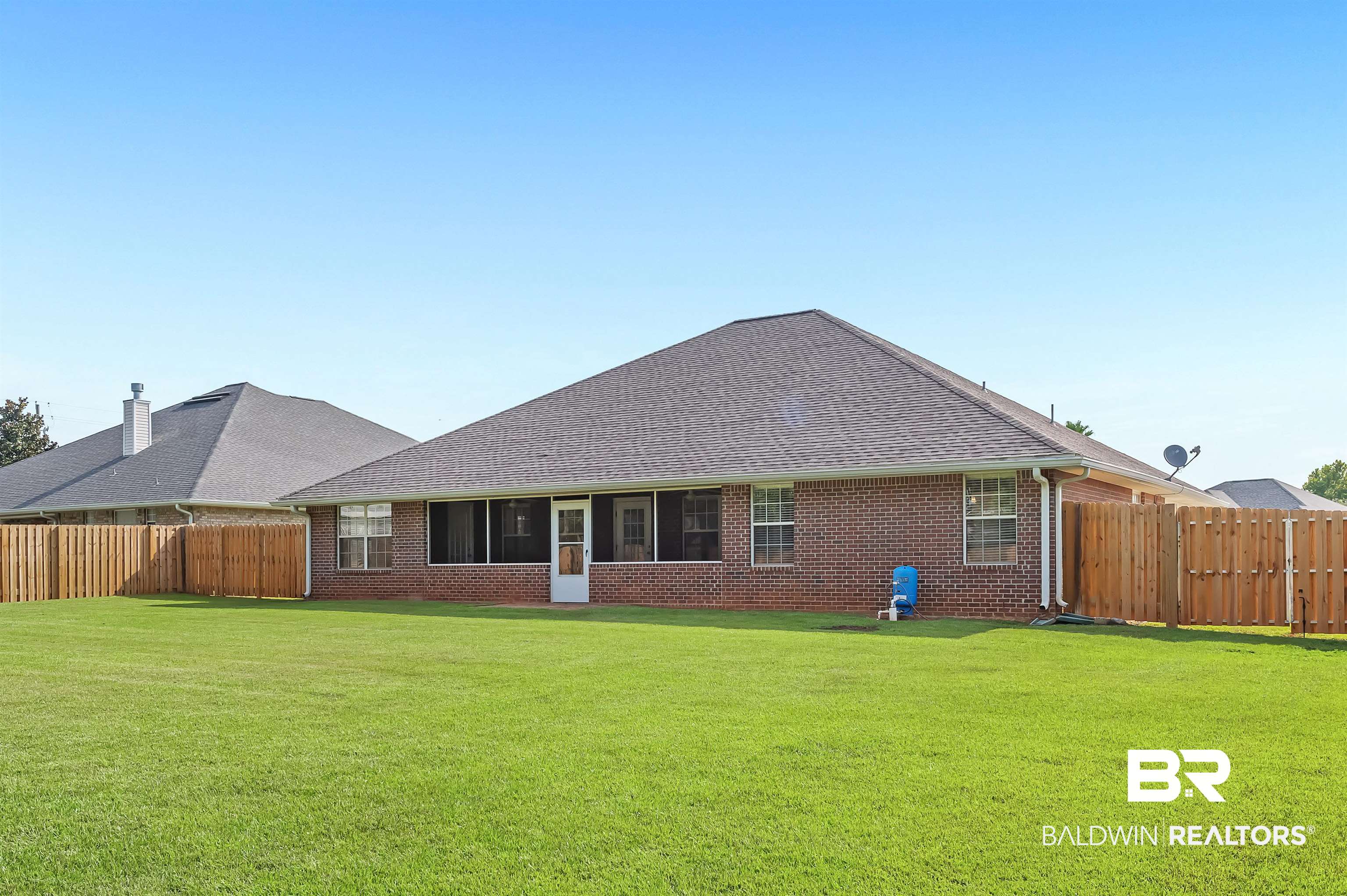 12443 Venice Boulevard Foley, AL 36535 - Photo 5 of 59 Rear view of house featuring a yard