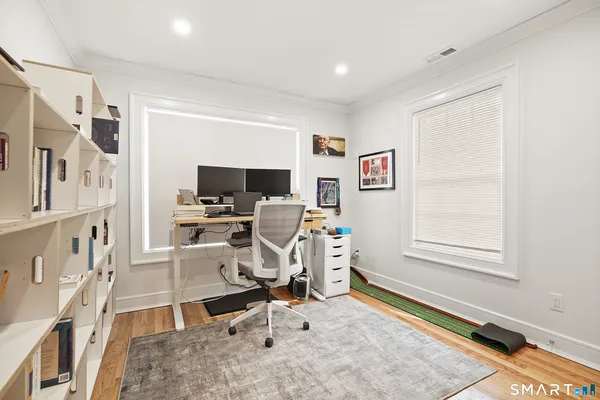 a bedroom with a bed and a table in it
