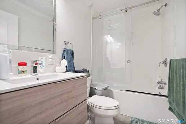 a kitchen with a sink appliances and cabinets