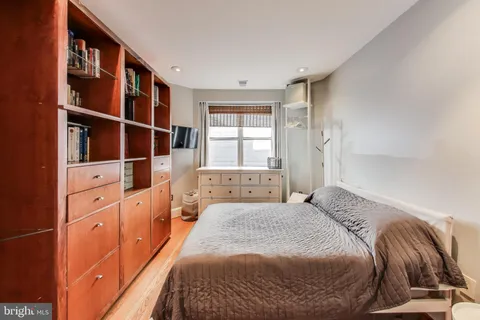 a bedroom with a bed and furniture