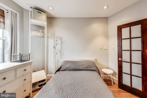 a view of a bedroom with furniture and staircase