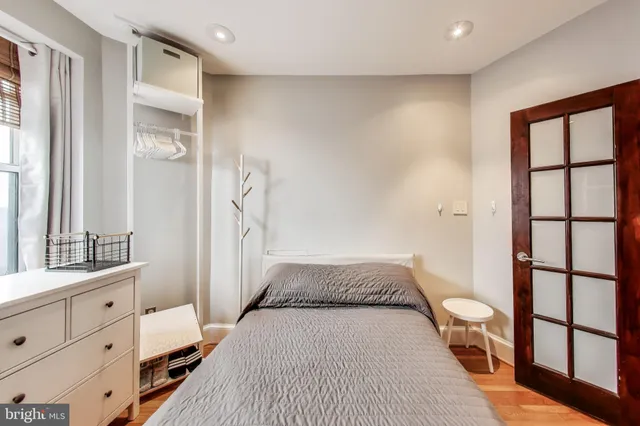 a view of a bedroom with furniture and staircase