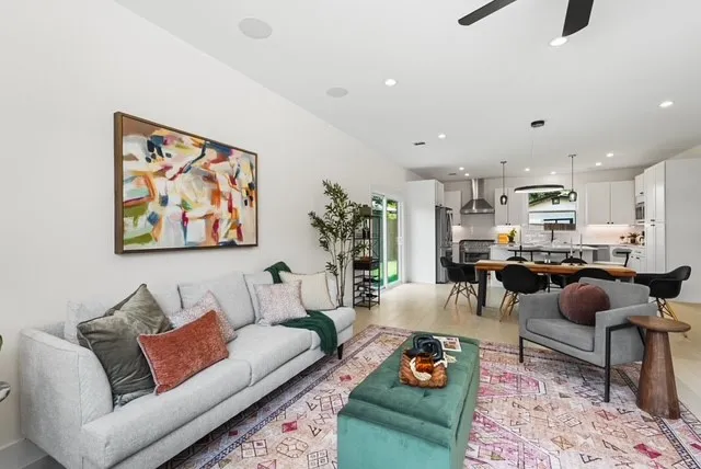 a living room with furniture and a rug