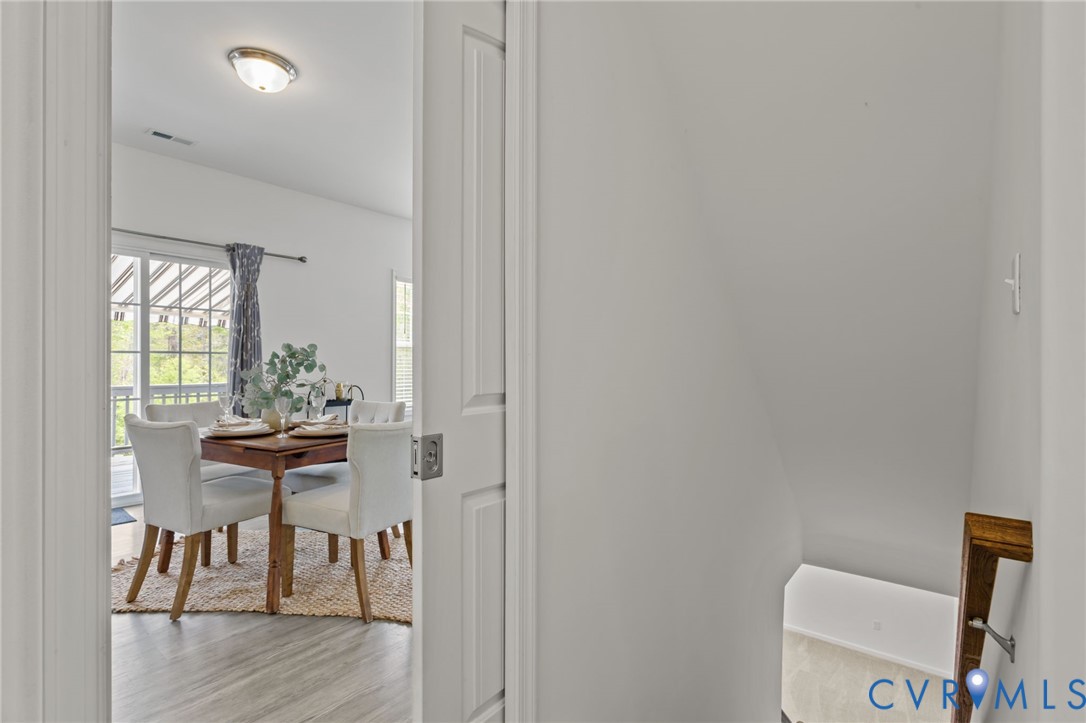 4237 Wells Ridge Court Chester, VA 23831 - Photo 15 of 47 a view of a dining room with furniture and wooden floor