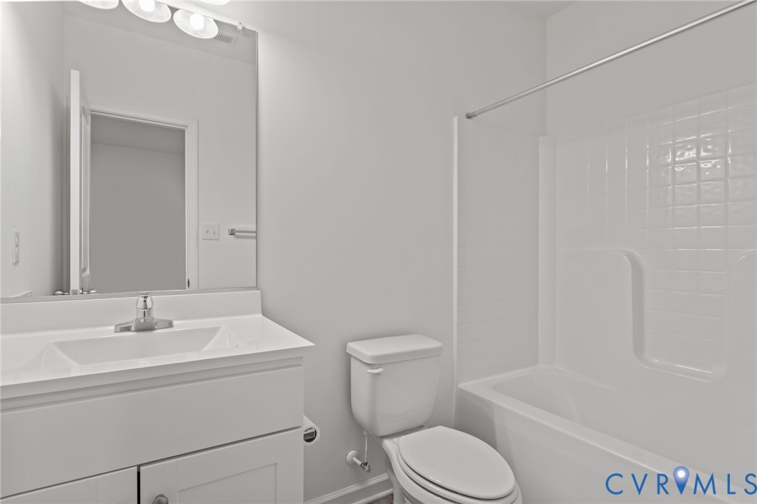 4237 Wells Ridge Court Chester, VA 23831 - Photo 18 of 47 a bathroom with a sink toilet and shower