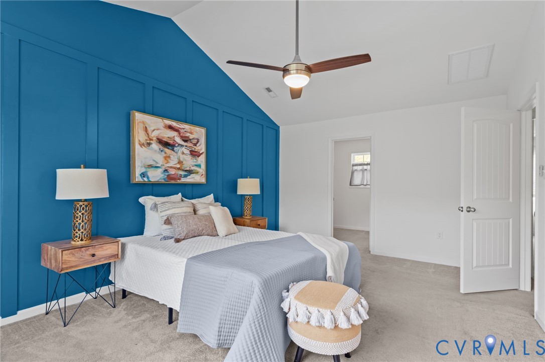 4237 Wells Ridge Court Chester, VA 23831 - Photo 28 of 47 a bedroom with a bed and a lamp