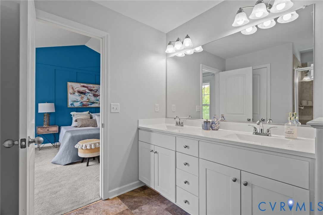 4237 Wells Ridge Court Chester, VA 23831 - Photo 31 of 47 a en suite bathroom with double sink and a mirror
