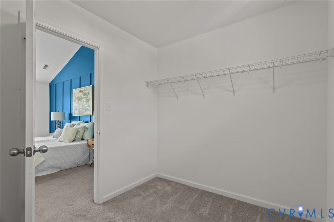 4237 Wells Ridge Court Chester, VA 23831 - Photo 32 of 47 a room that has a bed and a mirror