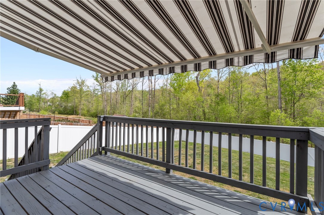 4237 Wells Ridge Court Chester, VA 23831 - Photo 34 of 47 a view of balcony with wooden floor and fence