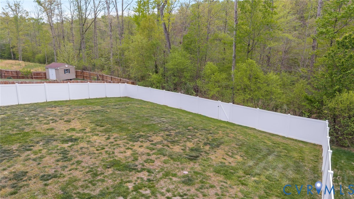 4237 Wells Ridge Court Chester, VA 23831 - Photo 39 of 47 a view of a field with a tree