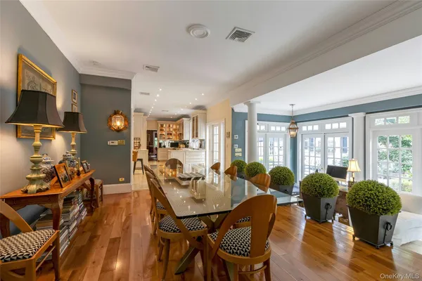 a dining room with furniture and wooden floor