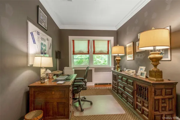 a bedroom with furniture and a window