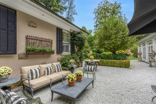 a outdoor living space with furniture and a garden