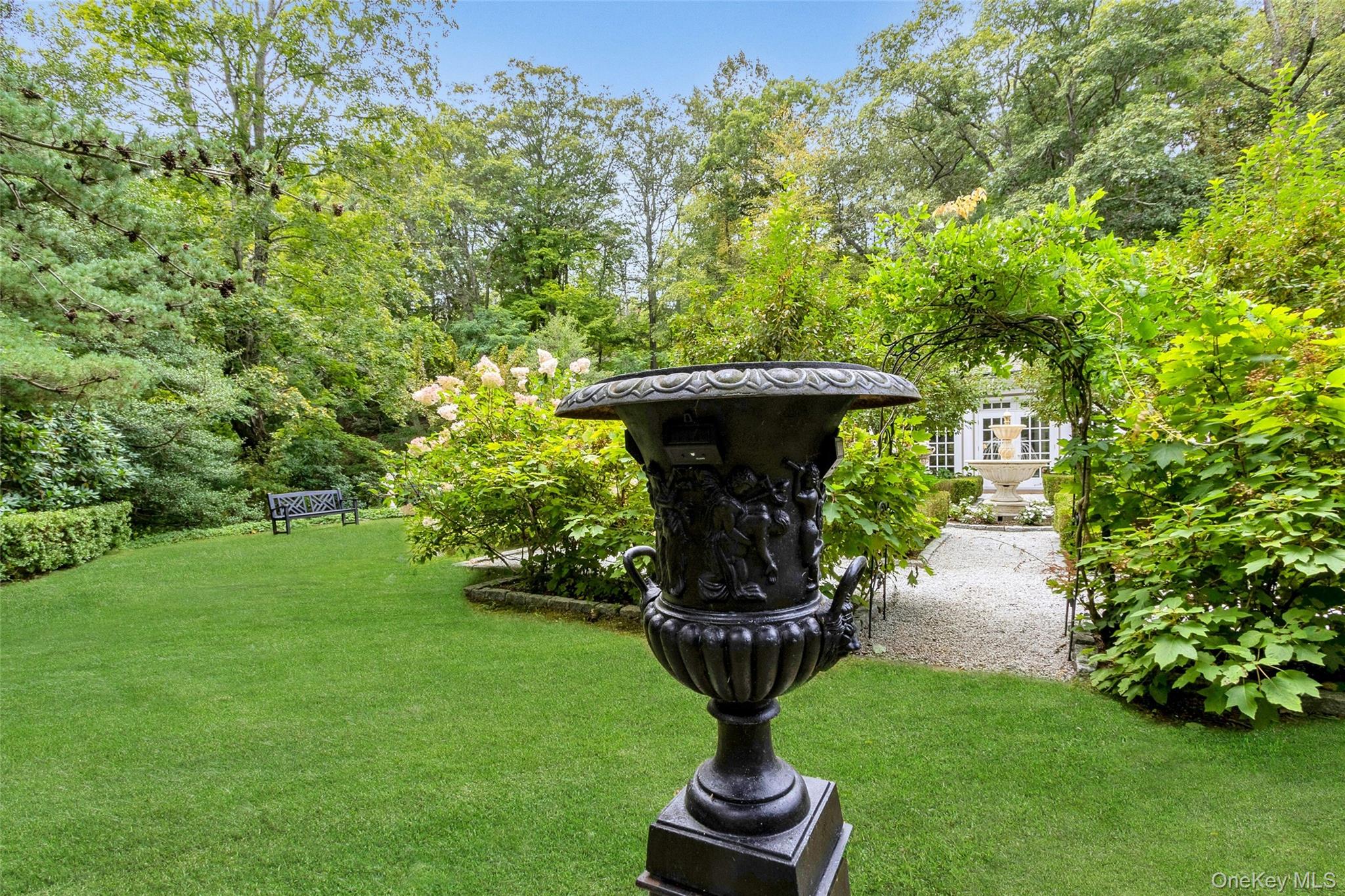 55 Mountain Farm Road Tuxedo Park, NY 10987 - Photo 30 of 42 a view of a fountain in the yard with large trees