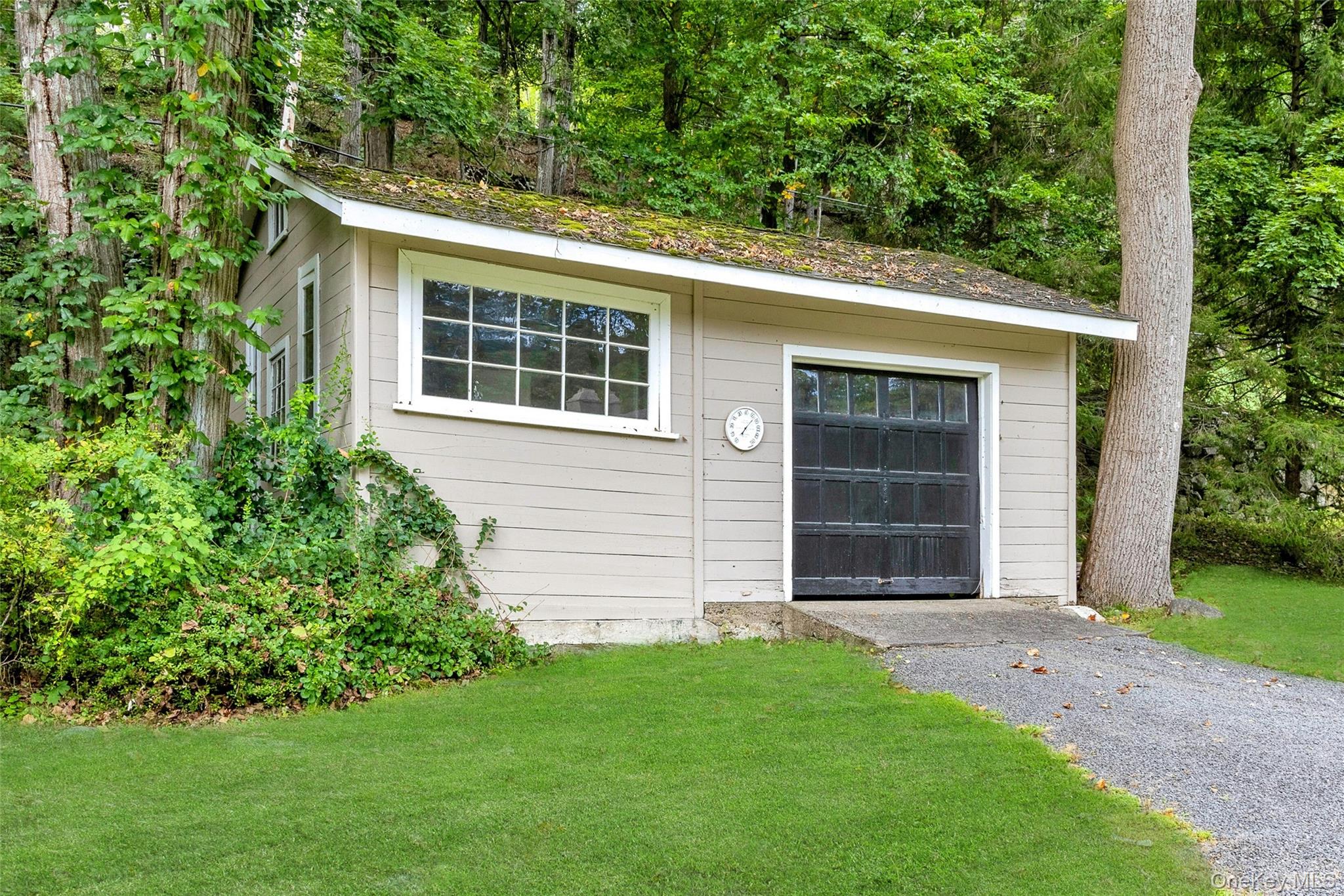 55 Mountain Farm Road Tuxedo Park, NY 10987 - Photo 32 of 42 front view of a house with a yard