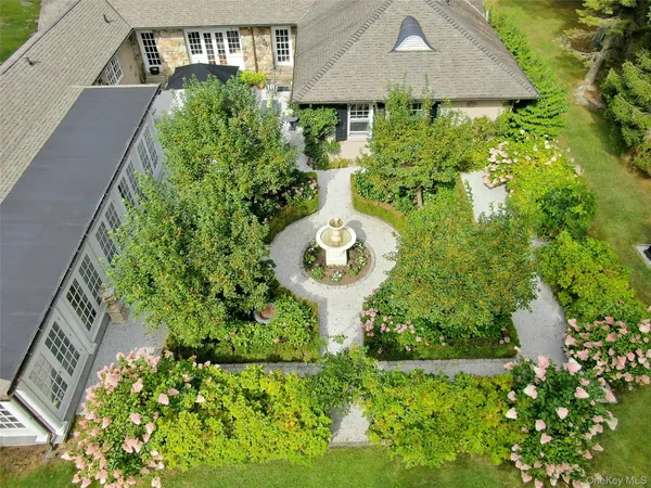 a view of a garden with a fountain