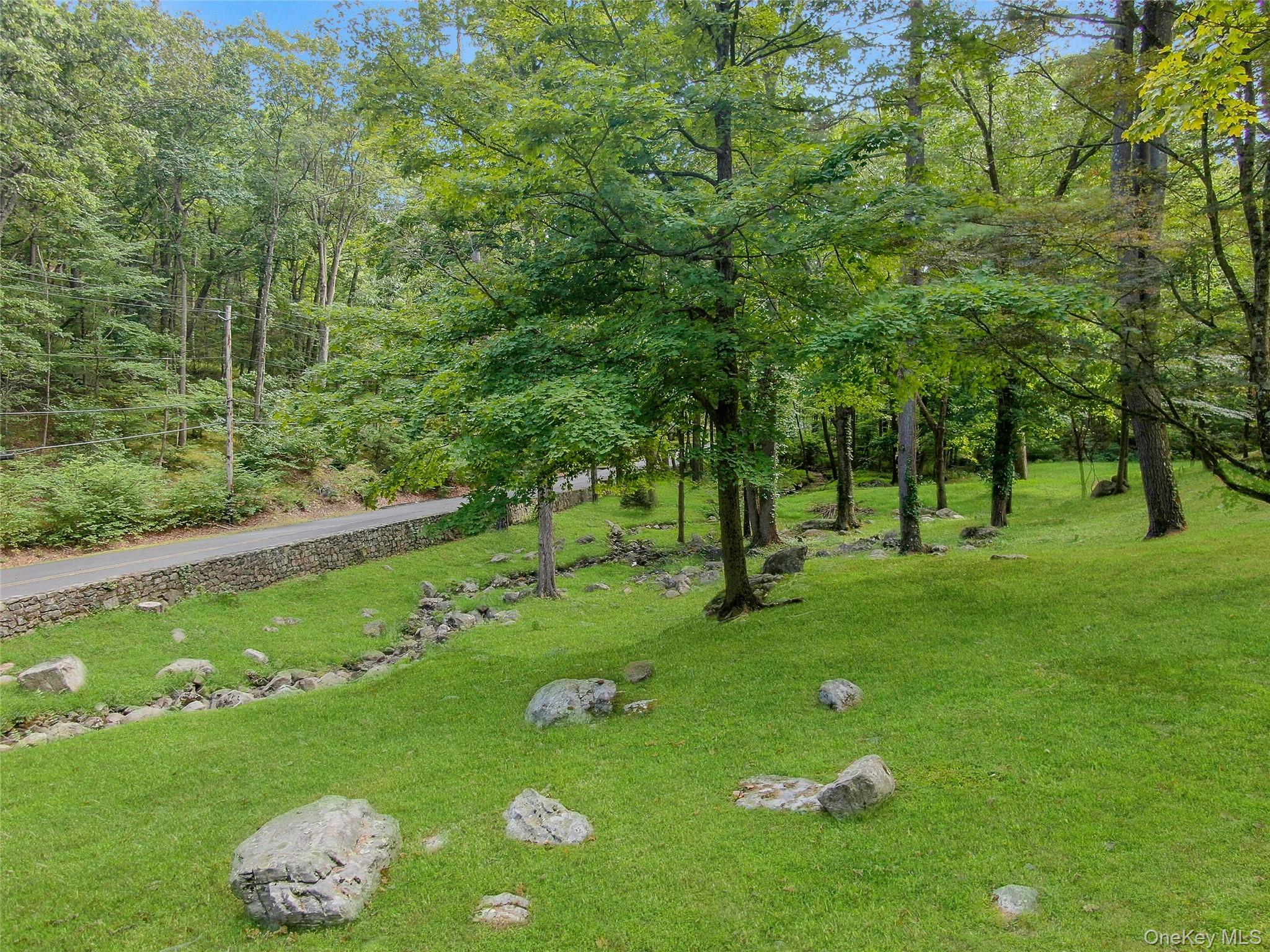 55 Mountain Farm Road Tuxedo Park, NY 10987 - Photo 38 of 42 a green field with lots of trees